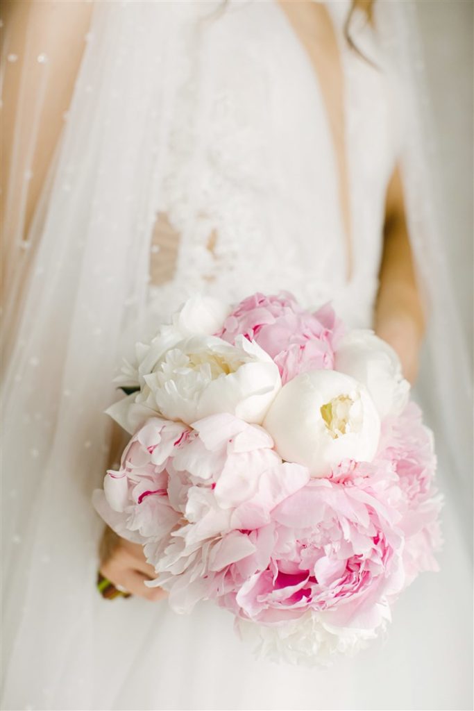 bride in esposa bridal dress bouquet