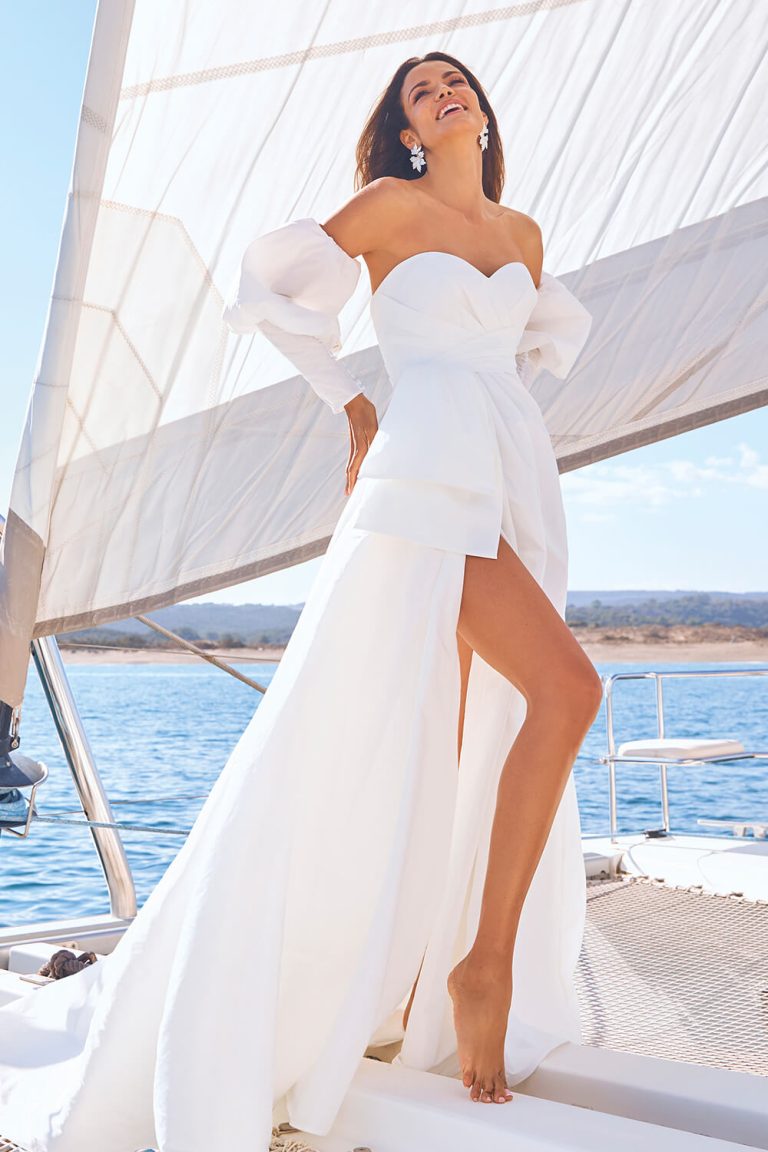 bride with bridal dress on boat