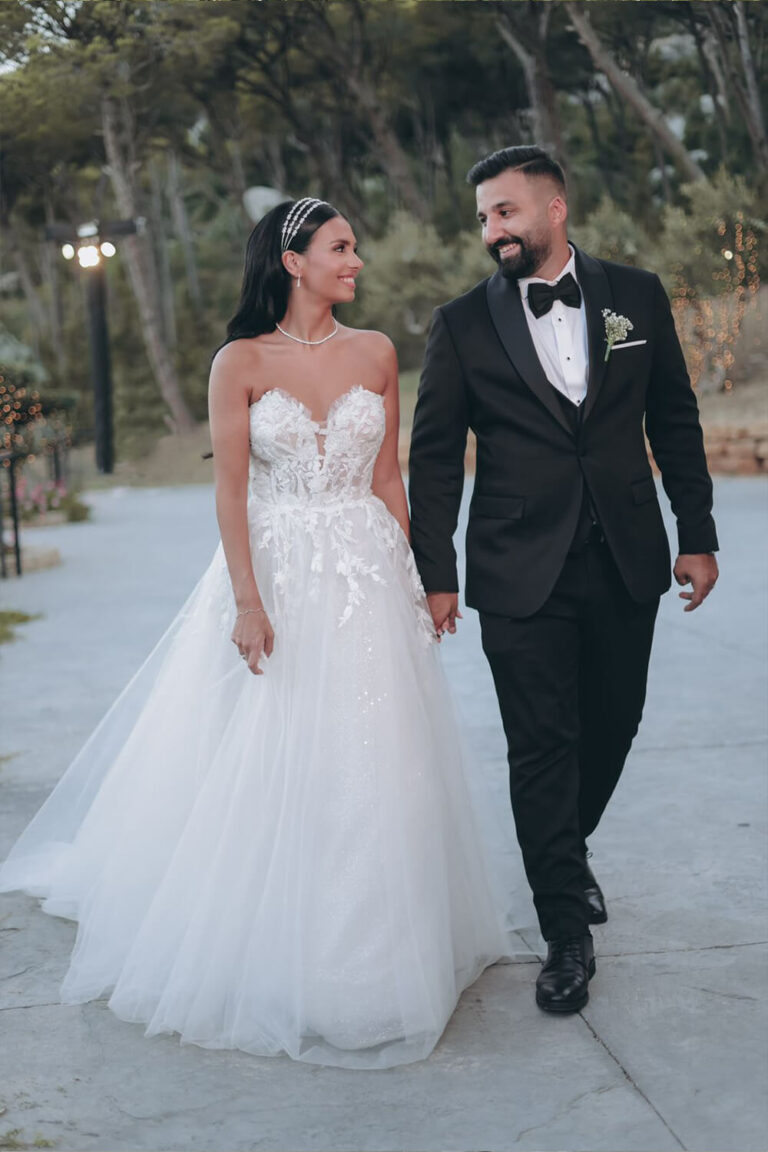 Bride and groom hand in hand